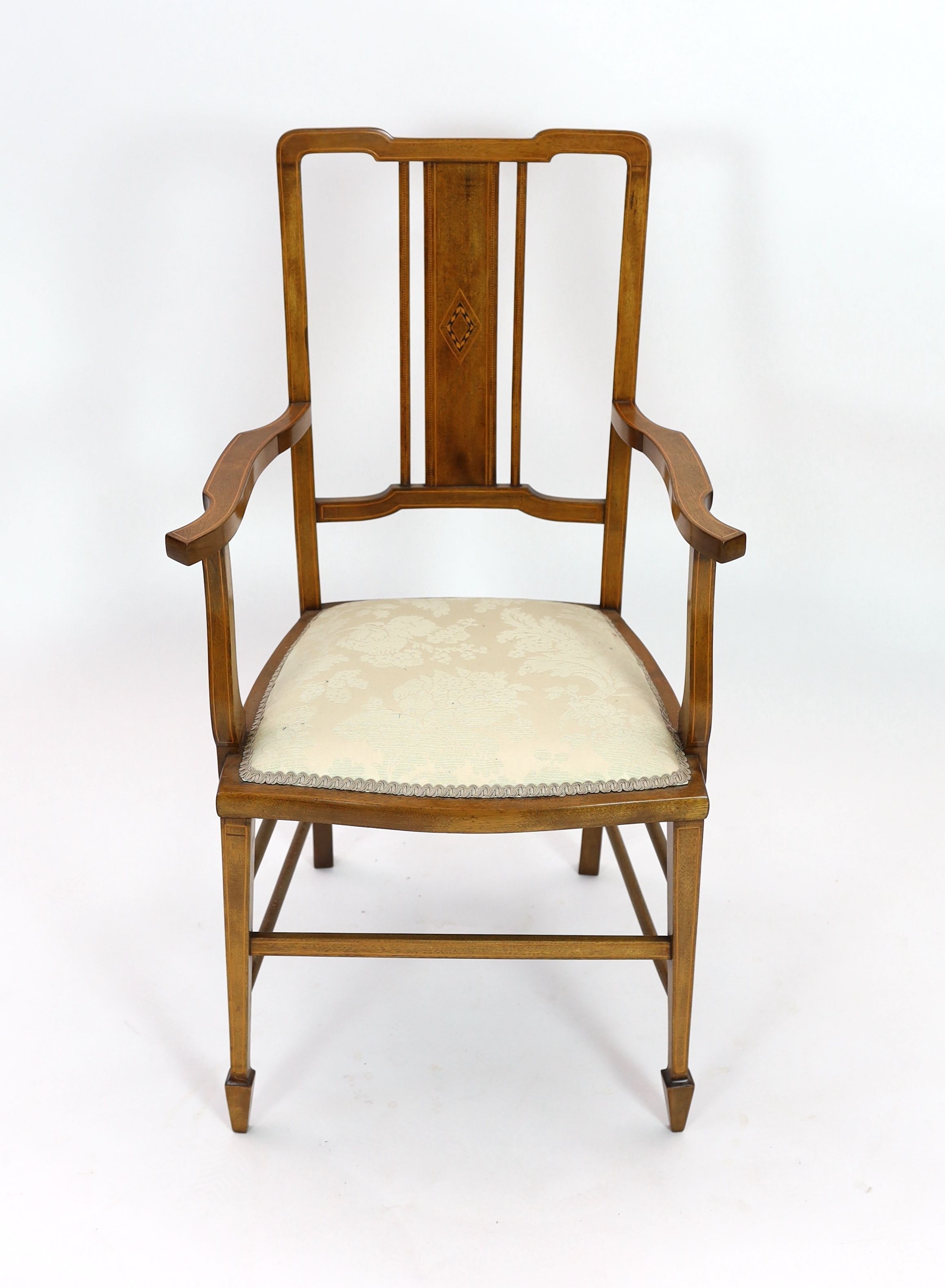 An Edwardian inlaid mahogany elbow chair, width 51cm depth 45cm height 96cm, and two Edwardian dining chairs